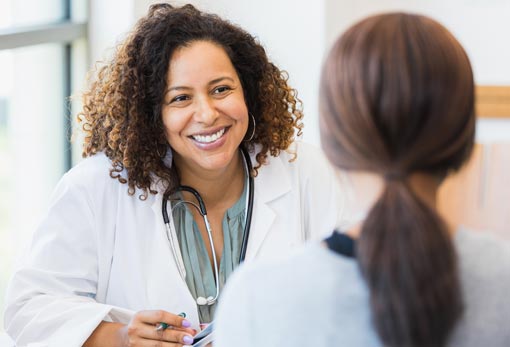 female doctor smiling at patient