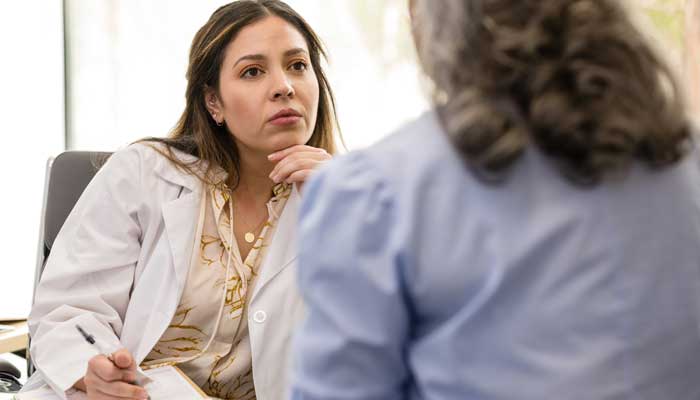 Female therapist listening to female patient