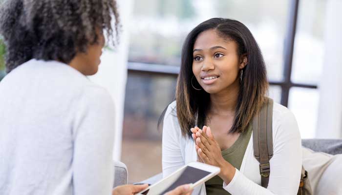 young-woman-talking-to-therapist_700 young-woman-talking-to-therapist_700